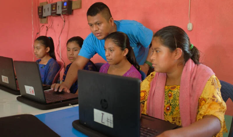TeacherWithStudentInComputerLab