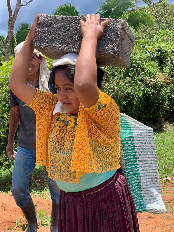 WomanCarryingBlock
