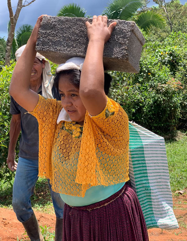 WomanCarryingBlock