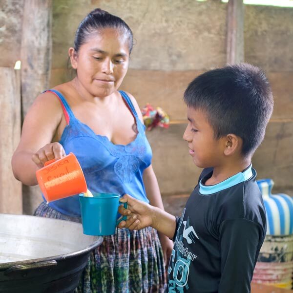 Guatemalan student receiving nutrient-enriched school snack